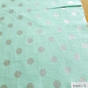Polka dots fabric in mint color with silver dots, made of cotton