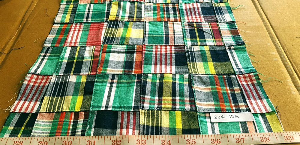 patchwork madras plaid fabric in preppy kelly green, black, yellow and red colors