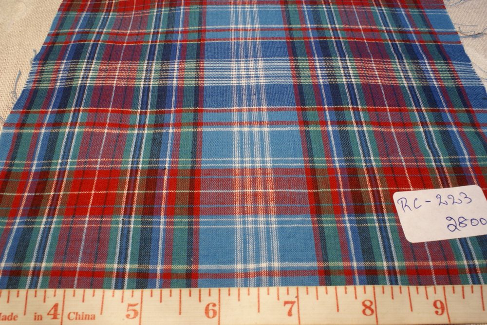 Madras fabric in preppy plaid colors of blue red green and black