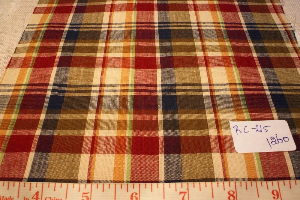 madras fabric in fawn, rust red, yellow, green and blue plaid