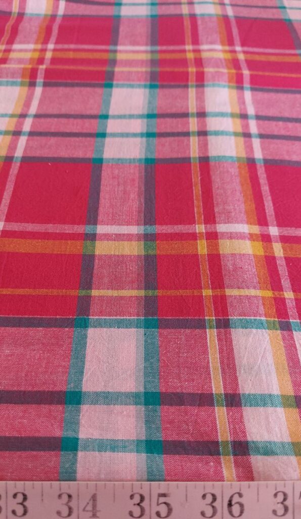 madras fabric in red, fuschia, lavender, yellow and green plaids