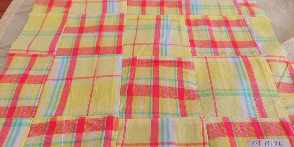 Patchwork Madras - patchwork plaid fabric made of madras plaids of various colors, used for preppy menswear & classic children's clothing.