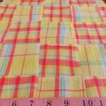 Patchwork Madras - patchwork plaid fabric made of madras plaids of various colors, used for preppy menswear & classic children's clothing.
