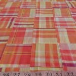 Patchwork Madras - patchwork plaid fabric made of madras plaids of various colors, used for preppy menswear & classic children's clothing.