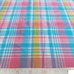 Plaid Fabric or madras plaid is made of cotton yarns in a plaid pattern. It is a summer preppy fabric, for shirting, menswear, kids clothing and beach wear.