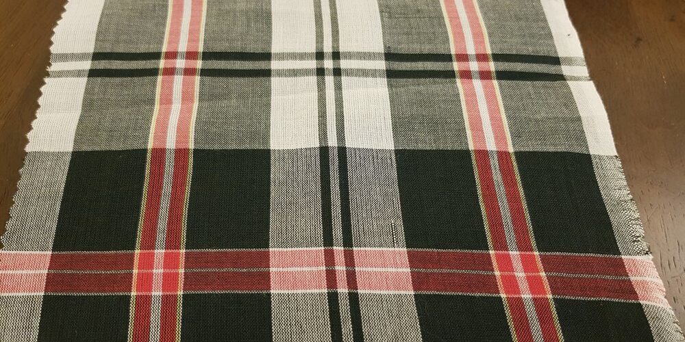 Bleeding Madras Fabric made with yarns dyed using vegetable dyes only, into a plaid madras pattern, for bleeding madras shirts.