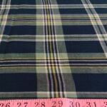 Plaid Fabric or madras cloth, made of cotton, used for plaid shirts, vintage menswear, plaid ties and bowties and classic children's clothing.