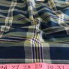 Plaid Fabric or madras cloth, made of cotton, used for plaid shirts, vintage menswear, plaid ties and bowties and classic children's clothing.