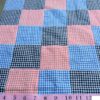 Gingham Patchwork fabric made of gingham squares sewn together into a patchwork fabric for shirts, boy's clothing and menswear.