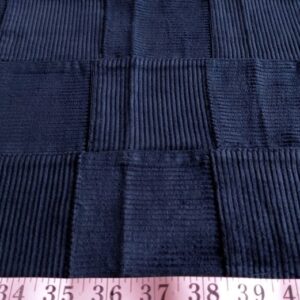 Corduroy patchwork fabric has a soft velvet-weave for use in men's jackets, corduroy pants, winter clothing, shorts & jackets, and for hats and caps.