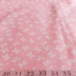 Bow print fabric, with gift bows on a pastel pink base