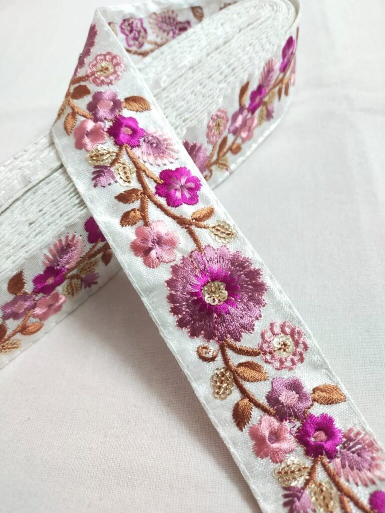 Embroidered trim or fabric trim, for couture sewing and gowns.