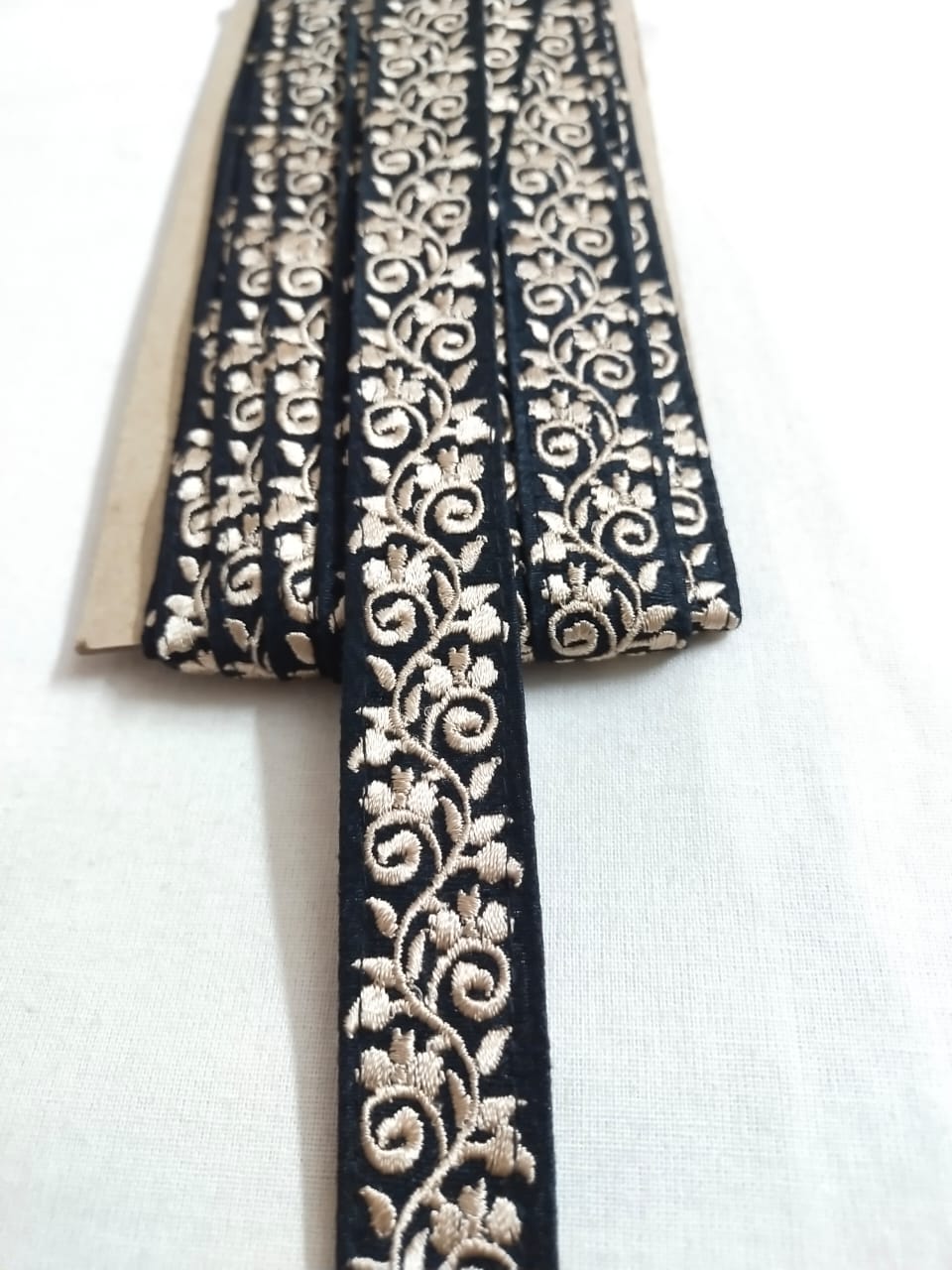 Embroidered trim or fabric trim, for couture sewing and gowns.