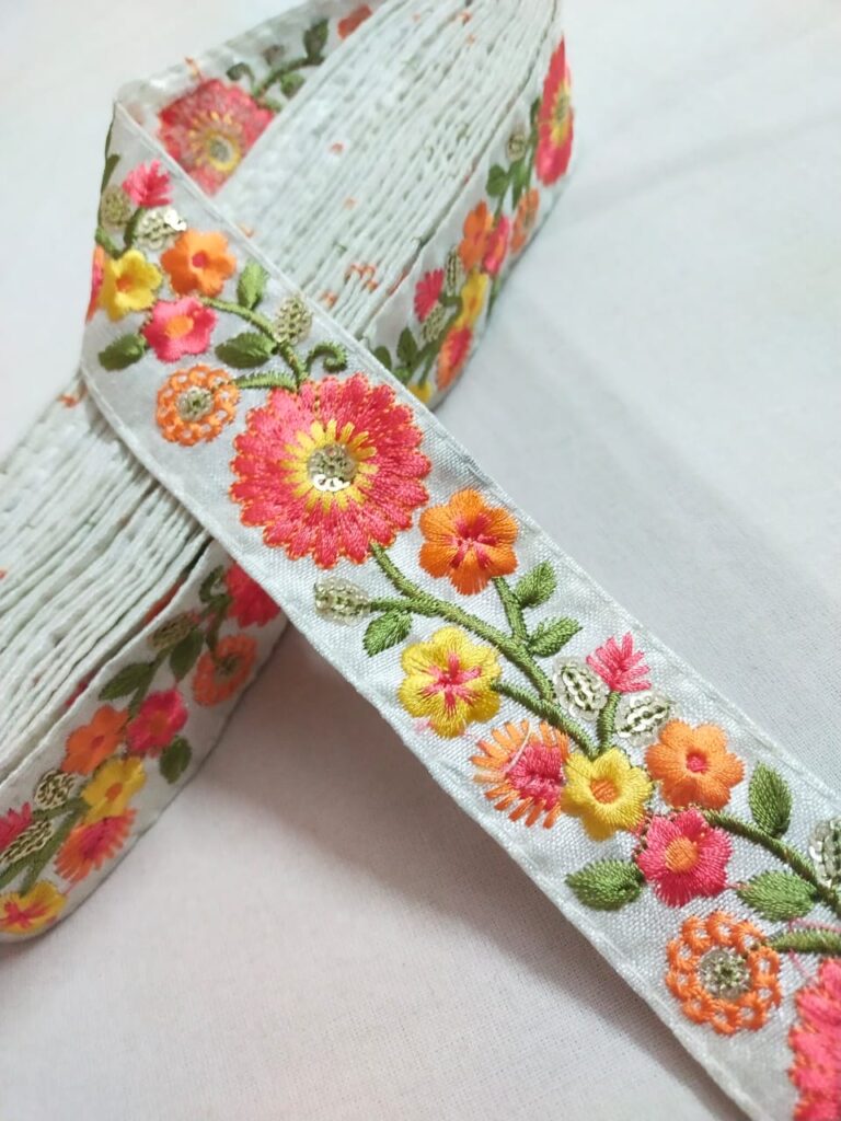 Embroidered trim or fabric trim, for use as borders for dresses and skirts