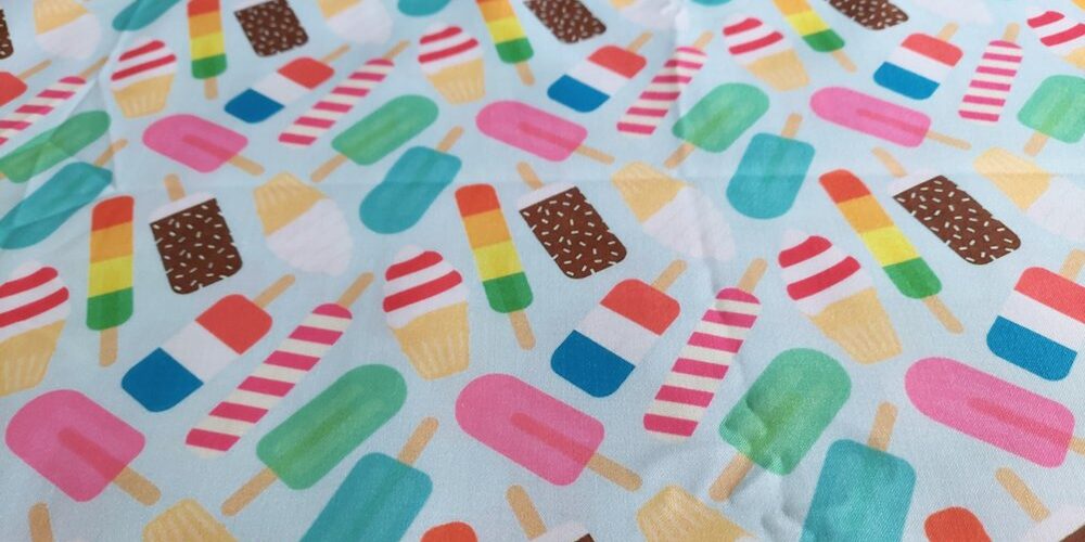 Novelty print fabric, for children's clothing, dog bandanas and quilting, with ice creams, cones and popsicle theme print.