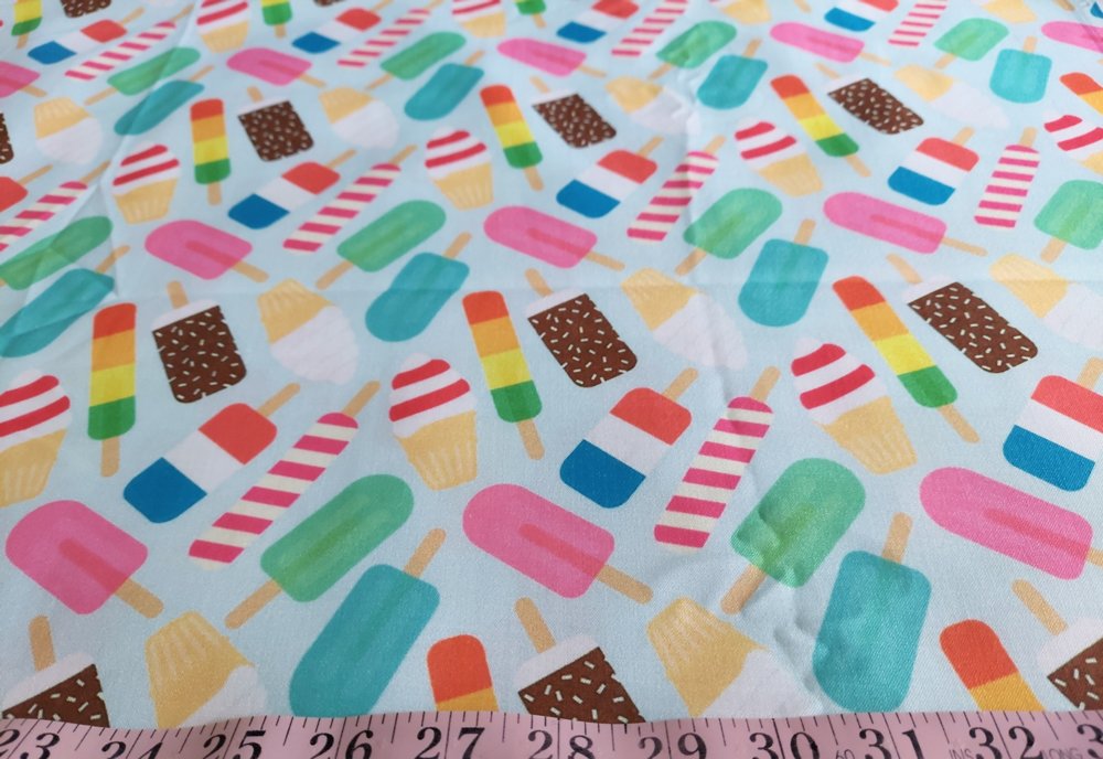 Novelty print fabric, for children's clothing, dog bandanas and quilting, with ice creams, cones and popsicle theme print.