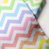 Novelty Print Rainbow Chevron fabric with multi-color stripes for children's clothing, dog bandanas, skirts & dresses.
