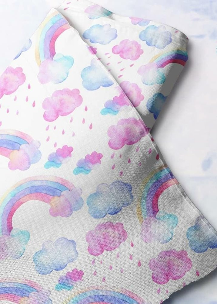 Clouds & Rainbows novelty print fabric for children's clothing, dog bandanas, skirts & dresses, and handmade ties and bowties.