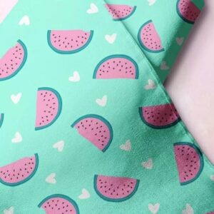 Novelty print fabric for children's clothing, dog bandanas and quilting, with pink dragon fruits / cut dragon fruits.