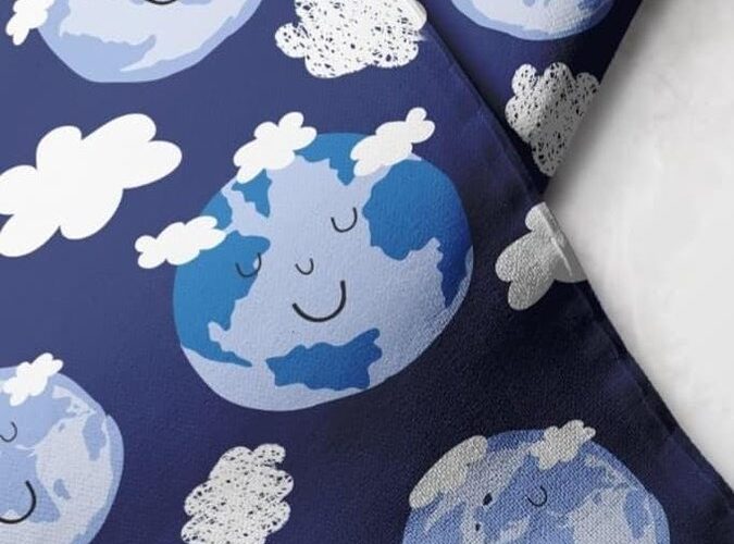 Novelty Print Fabric with Earth smiling & clouds printed, for sewing children's clothing, dresses, dog bandanas and bows.
