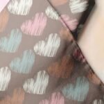 Novelty print fabric, for children's clothing, dog bandanas, pet clothing, with hearts print, for hobby sewing and crafts.