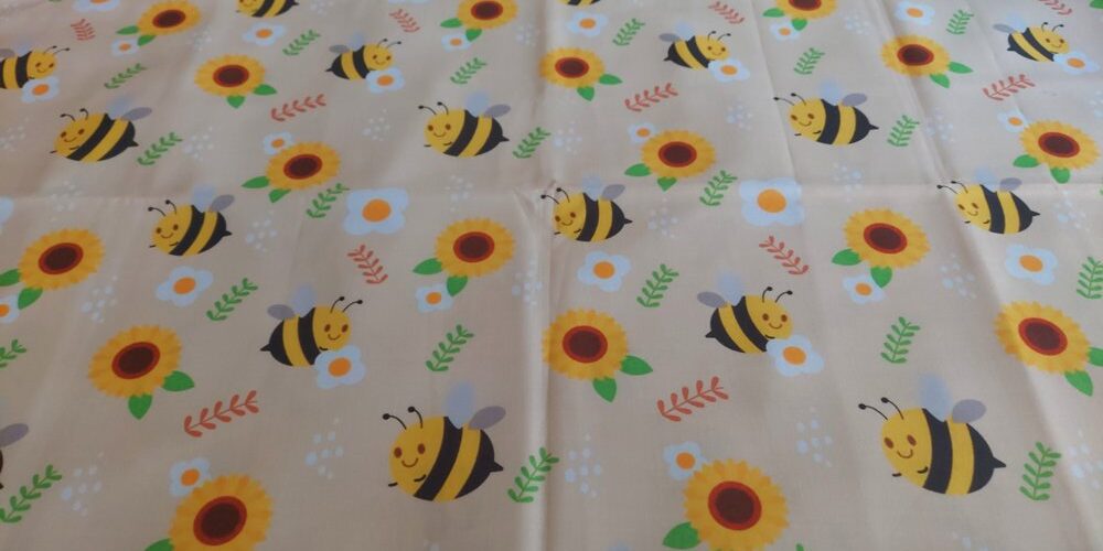 Cotton print fabric with bees and sunflowers, for dog bandanas, bowties, children's clothing, quilting, sewing and dresses.