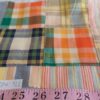 Patchwork plaid fabric made of individual plaids sewn together & used for plaid jackets, shirts, handmade children's clothing.