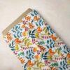Novelty Print Fabric with flowers and leaves printed, for sewing children's clothing, dresses, dog bandanas and bows.