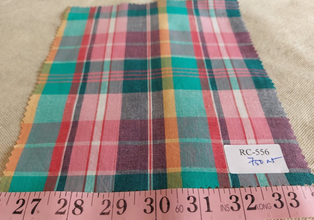 Madras fabric - plaid madras made of Indian cotton yarns of different colors suitable for menswear and children's apparel.