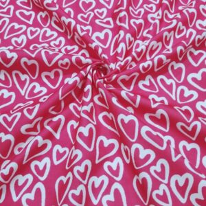 Novelty fabric with white hearts print, on bright pink, for quilting, skirts, bowties, children's clothing & dog and bandanas.