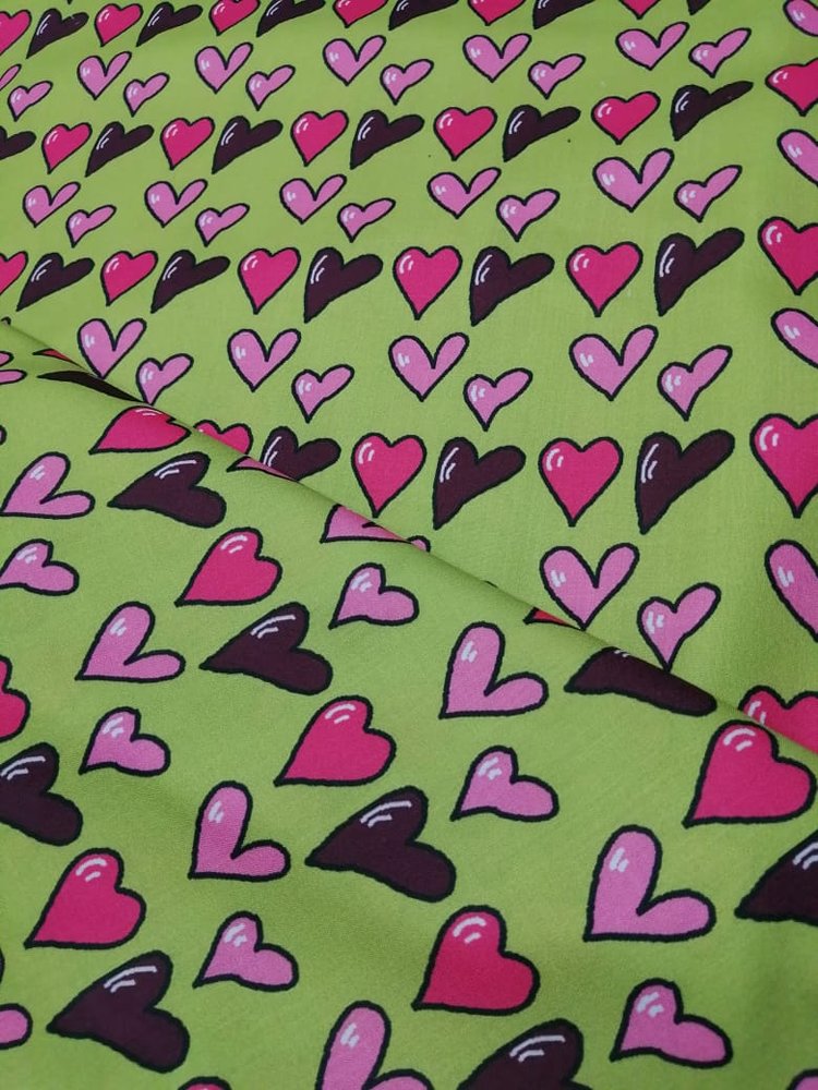 Novelty fabric with hearts printed, on olive green, for quilting, skirts, bowties, children's clothing & dog and bandanas.