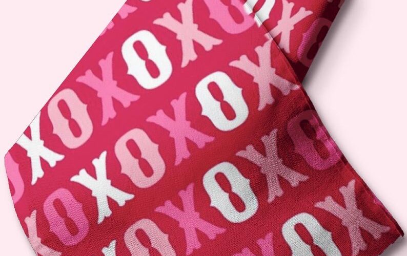 Novelty fabric with xoxo print, in bright colors, for quilting, skirts, bowties, children's clothing & dog and bandanas.