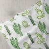 Novelty print fabric with Cactus print for dog bandanas, bows, vintage clothing, resort wear, skirts & children's clothing.