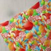 Novelty Fabric with Candies & candy sticks printed for children's clothing, dog bandanas & handmade bows & crafts.