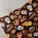 Printed fabric with cheesecakes, pastries & candies prints, for children's clothing, quilting, summer sewing, and crafts.