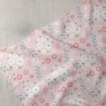 Pastel Daisies & Leaves Print Fabric, for sewing children's clothing, dresses, skirts, dog & cat bandanas and bows & crafts.
