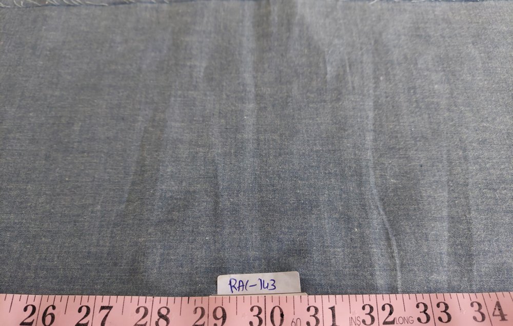 Striped Chambray Fabric FABRIC: Striped Chambray fabric for shirts & dresses. WIDTH: 44 inches. WEIGHT: Medium-Light weight. COLOR SCHEME: Broad Stripes in dark gray and white. DRAPING & THICKNESS: This fabric drapes fairly well due to its medium-light weight,and being cotton it crushes a bit, and gets back in shape equally well. Low-heat Steam press ideal though not required. It allows some light to pass through when held up against a bulb/natural light. FINISH & FEEL: Regular soft cotton plain-weave feel. MINIMUM CUT: 1 yard SHIPPING in USA:Usually 6-7 yards of these fabrics can be shipped in a $10 pack. UK shipping at GBP 10 per pack of 4 yards. Contact us for WHOLESALE DISCOUNTS THAT START AT A MINIMUM OF 50 YARDS TOTAL ORDER.  Or visit our wholesale catalog.