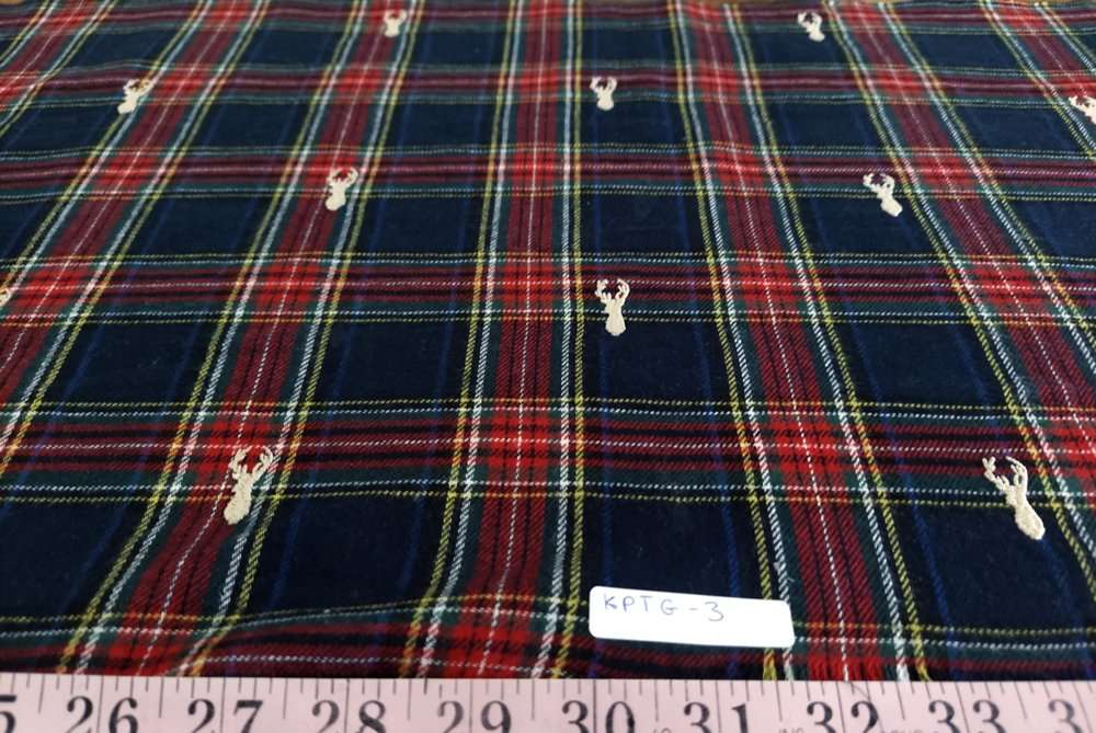 Flannel check fabric with Christmas reindeers embroidered, for shirts, outdoor clothing, Fall clothing & children's clothing.