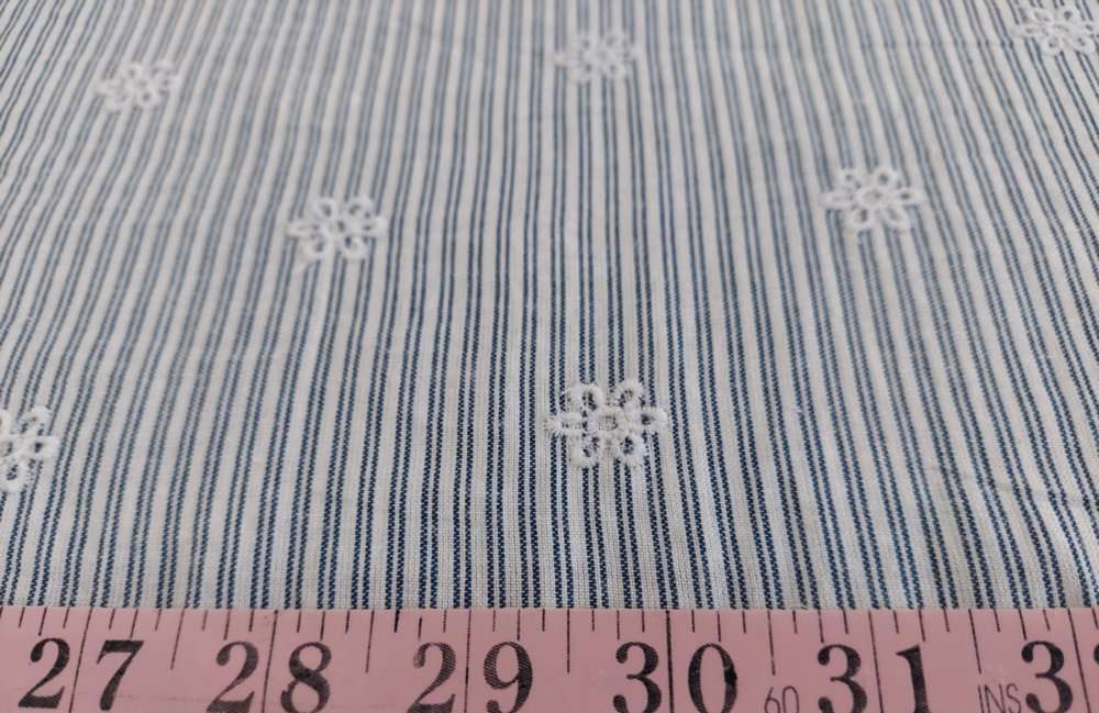 Striped fabric with embroidered flowers, perfect for vintage clothing like shirts, bowties, and classic children's clothing.
