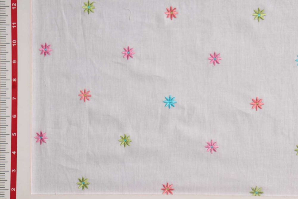 Embroidered cotton fabric with multi colored flower motifs, perfect for vintage dresses, skirts, bowties, shirts & pinup clothing.