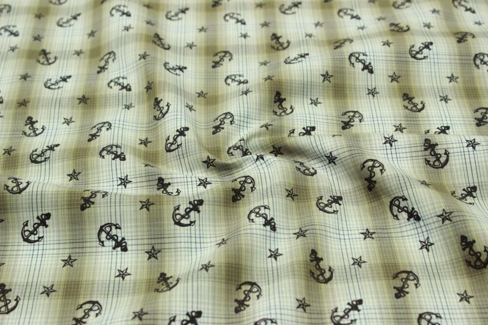 Novelty fabric with anchors printed on a plaid, for skirts and dresses, bows, handmade children's clothing, handmade crafts & bandanas.