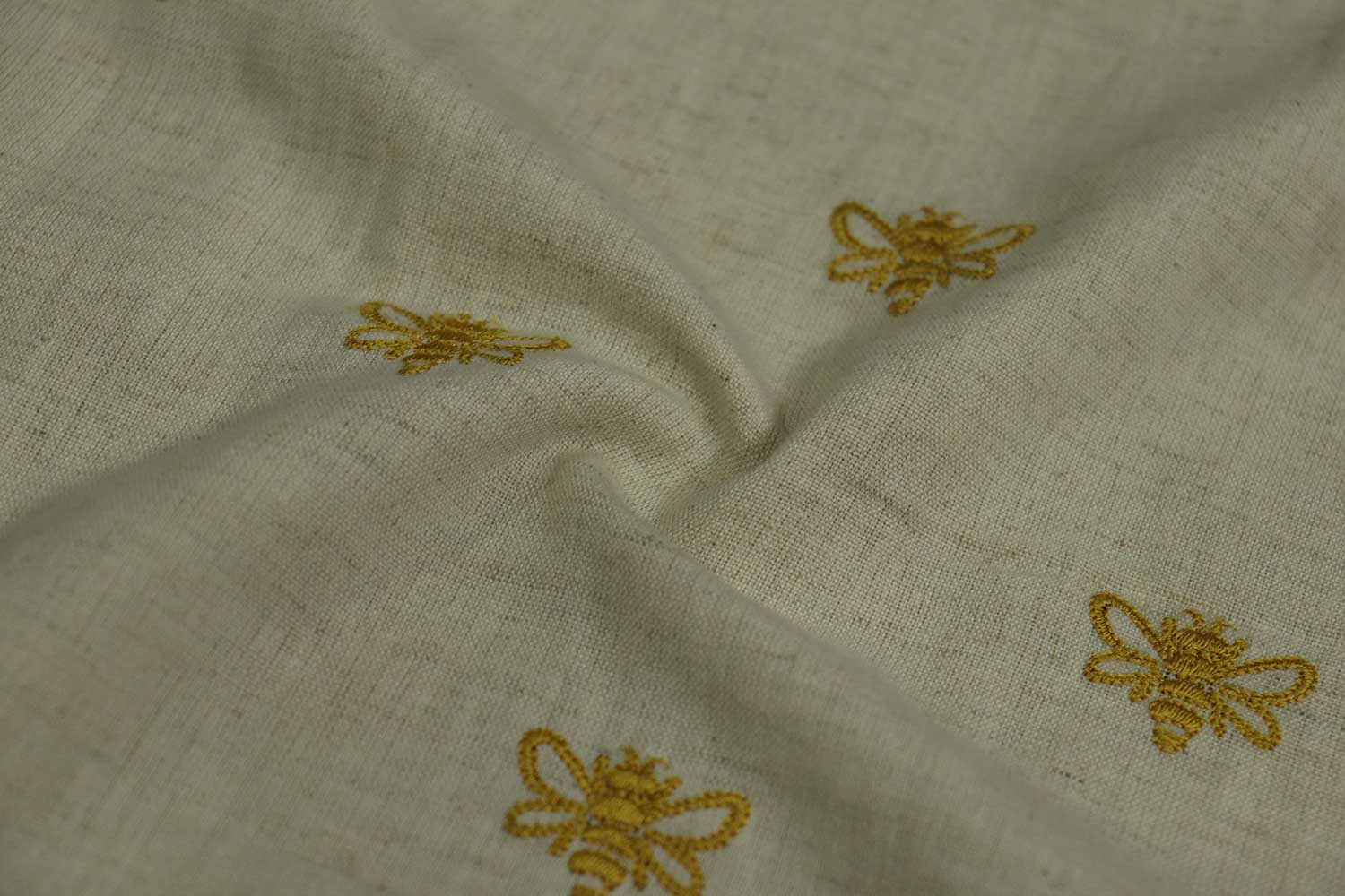 Embroidered cotton fabric with honey bee motifs, perfect for vintage dresses, skirts, bowties, dog bandanas & pinup clothing.
