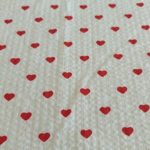 Seersucker with hearts print fabric for handsewn children's clothing, retro & vintage dresses, dog bandanas, bowties & bows.