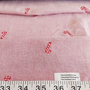 Embroidered stockings on pink chambray fabric for sewing shirts, skirts and dresses, children's clothing & dog bandanas.