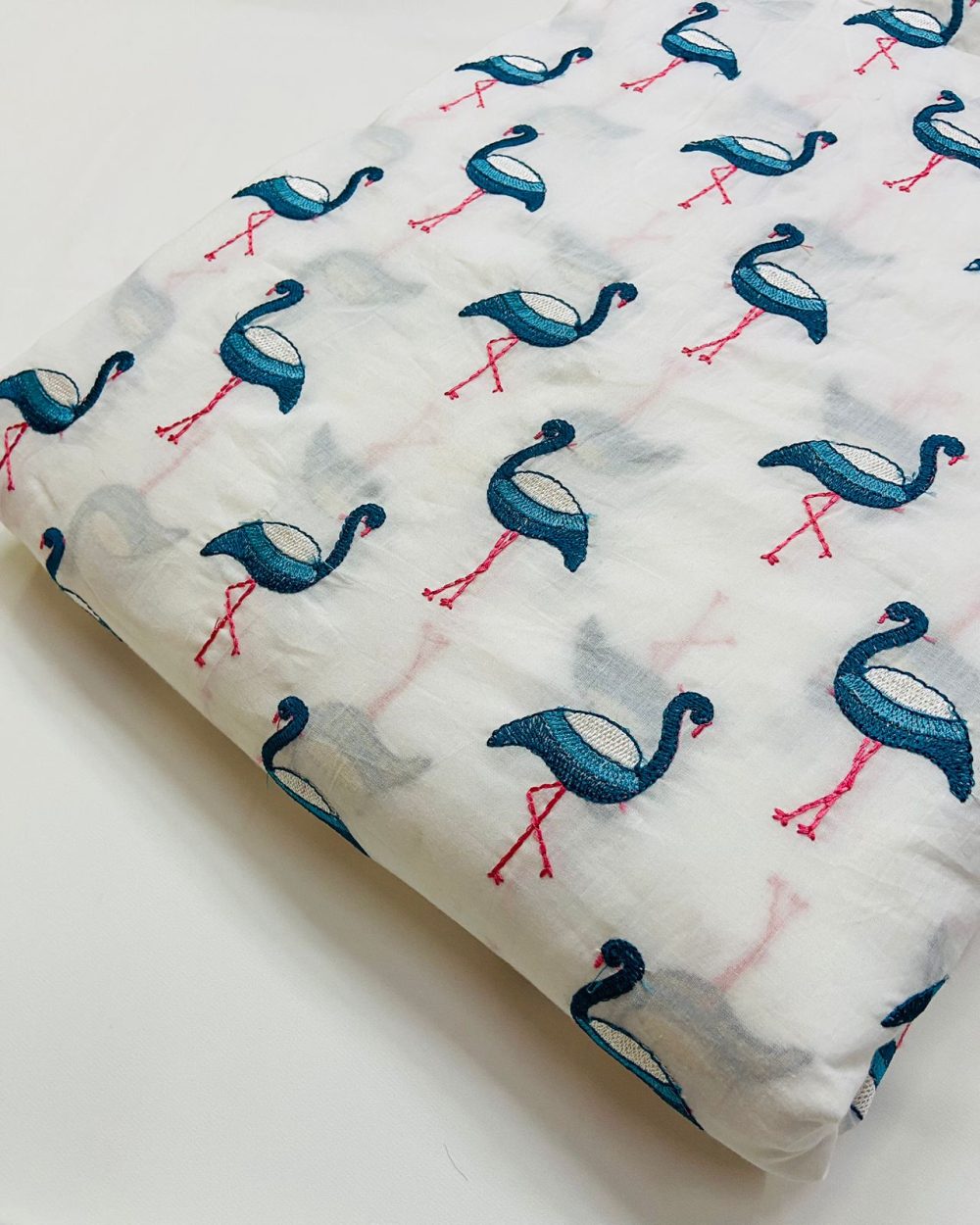 Embroidered blue flamingos cotton fabric, for sewing children's clothing, costumes, dog bandanas, shirts & tops and dresses.